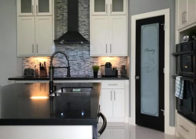 Modern White Cabinet Black Counter Top Kitchen Design 2